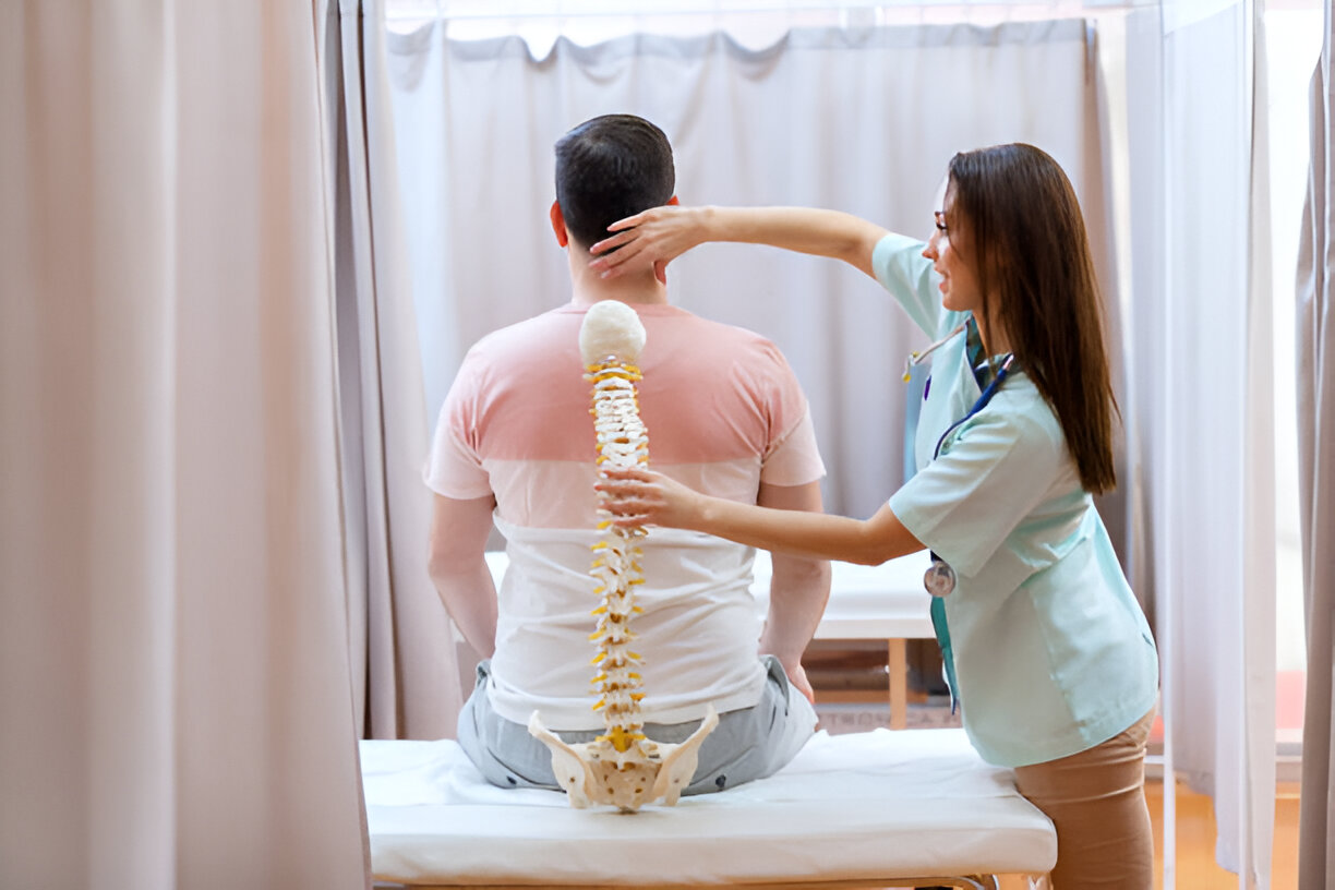 Doctor examining patient spine